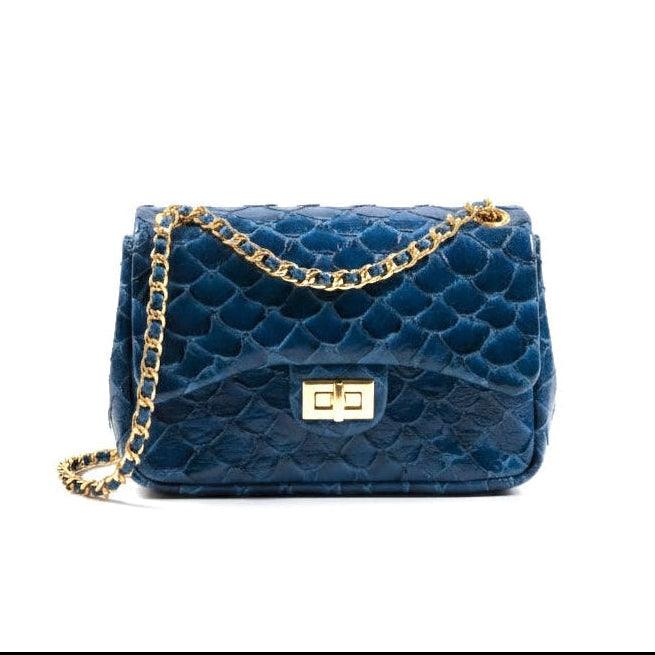 Blue quilted handbag with a gold chain on a white background