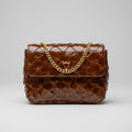 Brown textured handbag with a gold chain on a light gray background